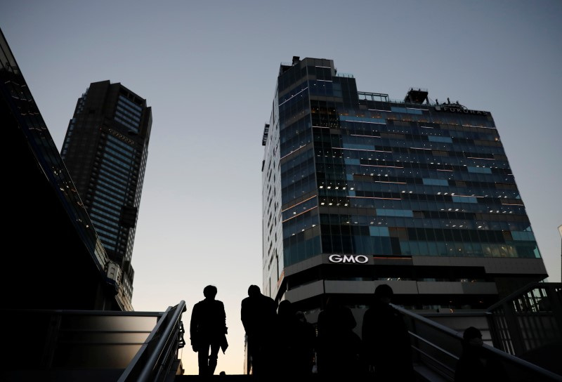 Japan to sidestep funding in tax cut outline, keep fiscal concern alive